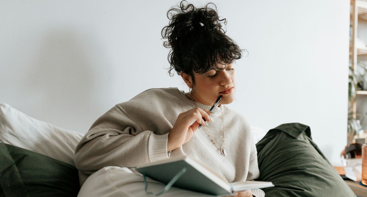 woman writing in a book