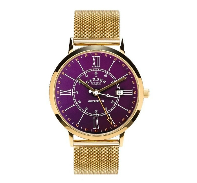 A gold watch with a purple face