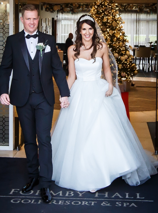 Bride and groom Christmas wedding and Formby Hall