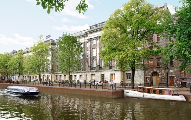 A row of brick buildings on the river